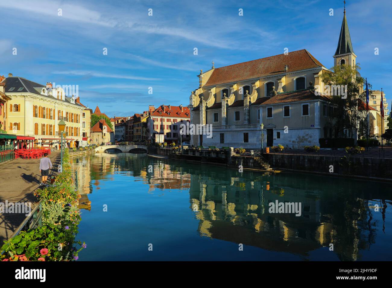 Colourful medieval buildings reflected on water of the canal in Annecy, France Stock Photo