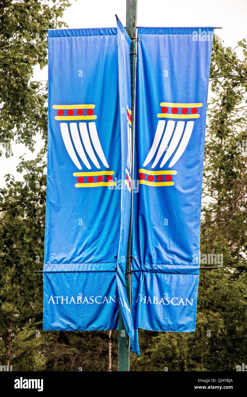 2022 06 25 Anchorage Alaska USA - Indiginous- First Peoples Flag banner on post with traiditonal symbol on top and ATHABASCAN written on the bottom Tr Stock Photo