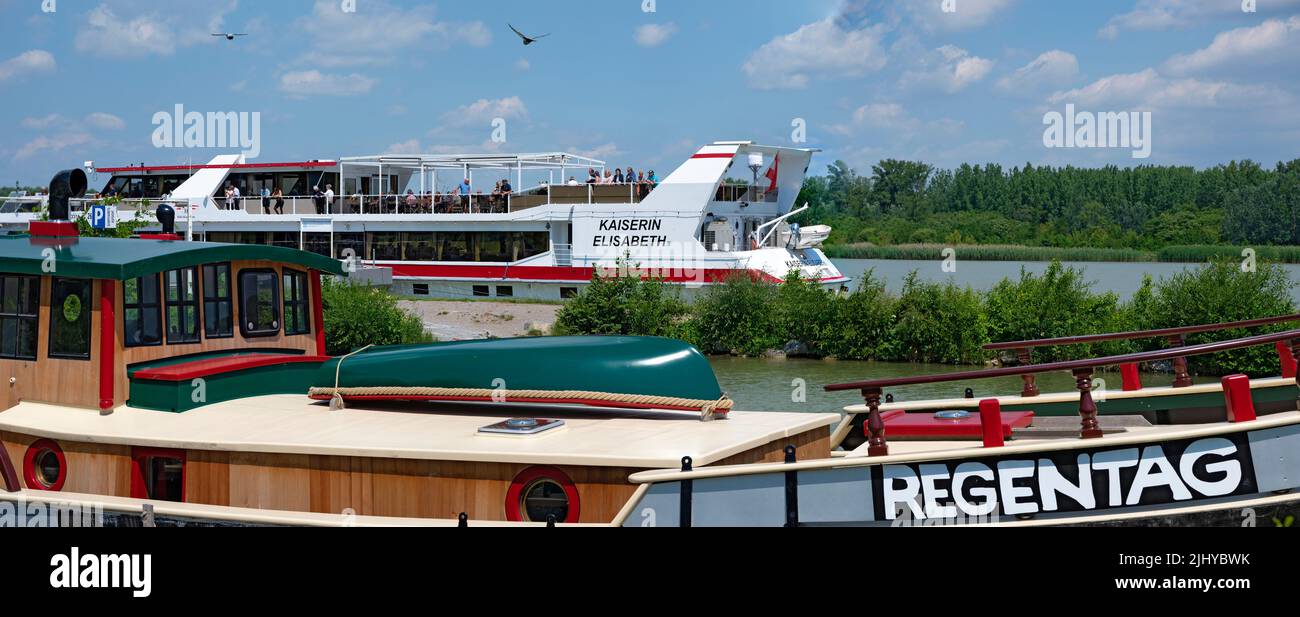 pleasure vessel Empress Elisabeth of the DDSG Blue Danube behind the ship Rainday of  deceased artist Friedensreich Hundertwasser at the river Danube Stock Photo