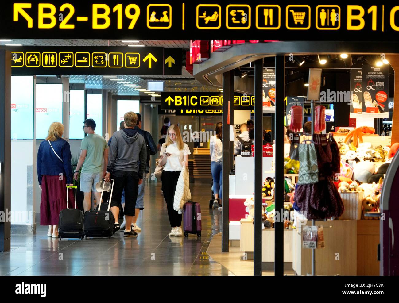 Passengers walk to their terminals in Riga International Airport, Latvia July 21, 2022. REUTERS/Ints Kalnins Stock Photo