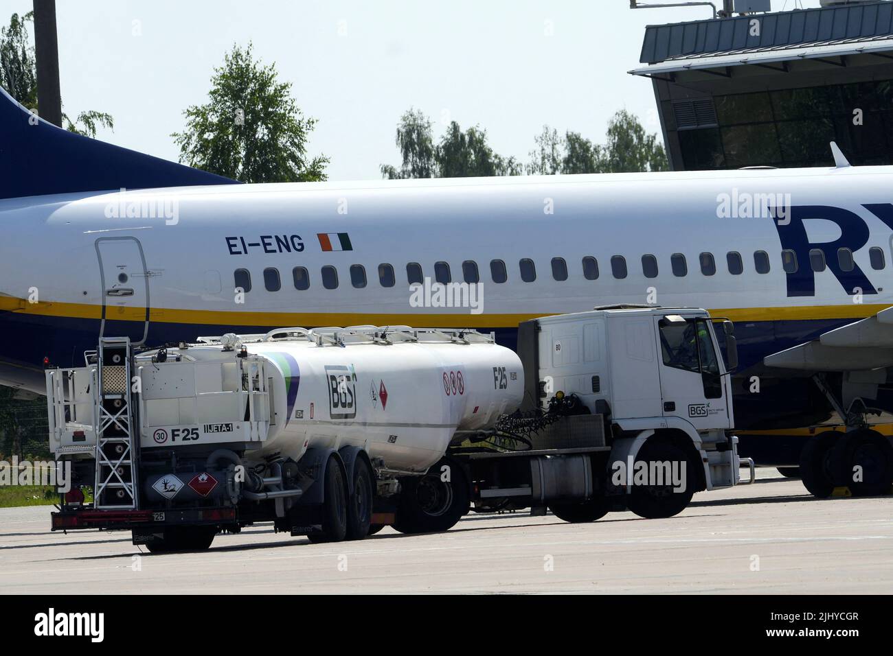 Fueling truck drives past Ryanair aircraft Boeing 737-8AS at Riga International Airport, Latvia July 21, 2022. REUTERS/Ints Kalnins Stock Photo