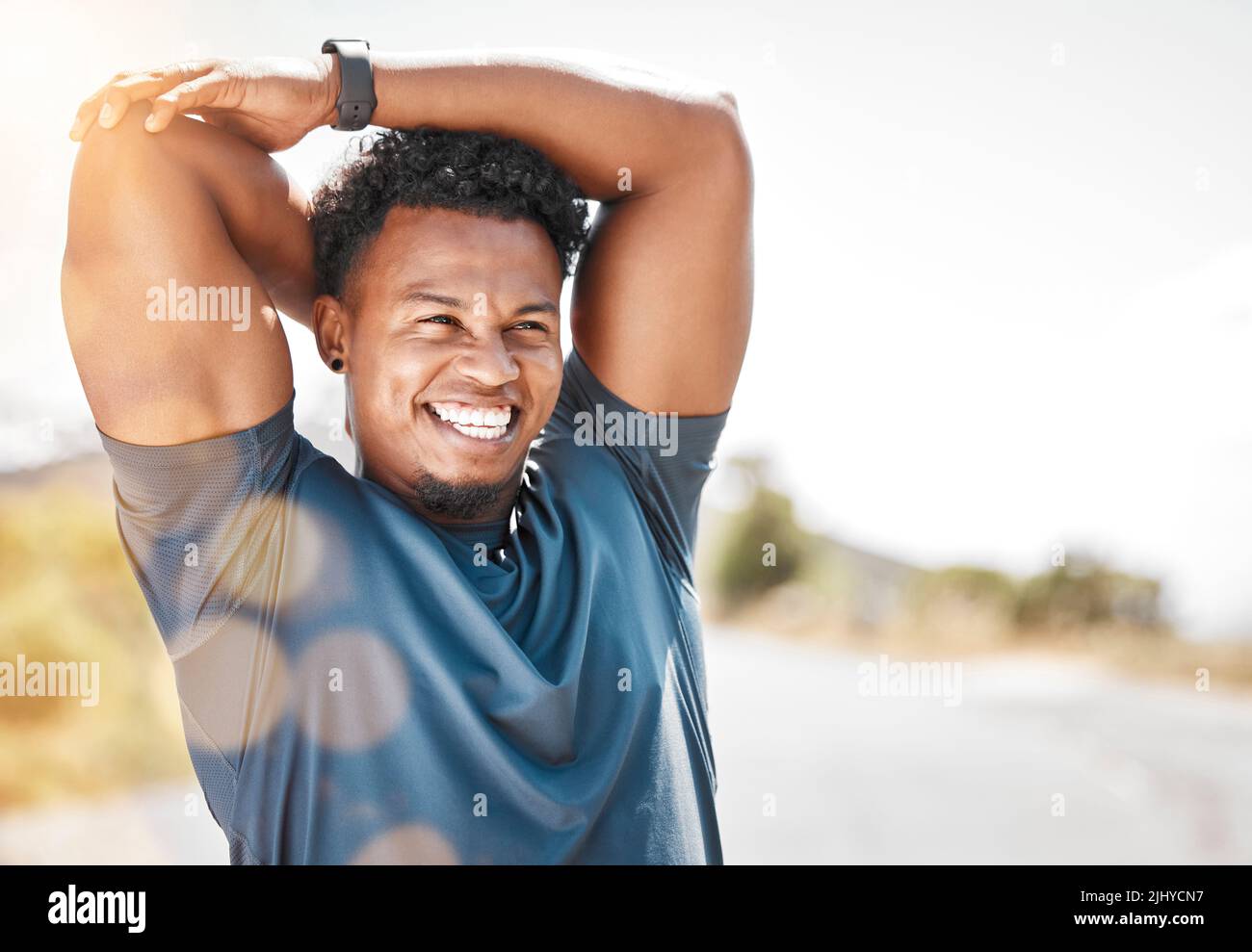 Exercise is labor without weariness. a sporty young man stretching before a run outdoors. Stock Photo