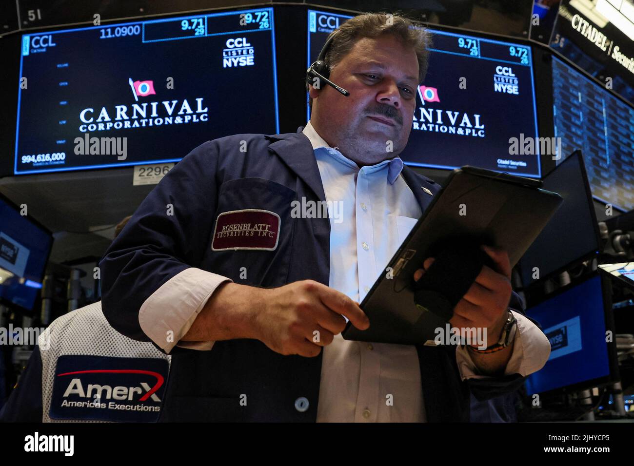 A trader works at the post where Carnival Corporation is traded on the floor of the New York Stock Exchange (NYSE) in New York City, U.S., July 21, 2022.  REUTERS/Brendan McDermid Stock Photo