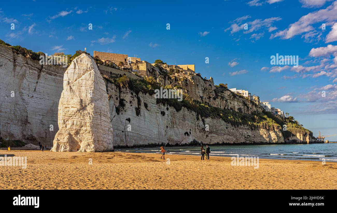 The sandy beach of Pizzomunno with the famous stack in Vieste. Province of Foggia, Apulia, Italy, Europe Stock Photo