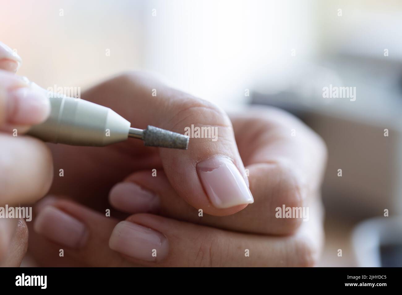 Removing shellac from the nails with fraser. Closeup. Selective focus