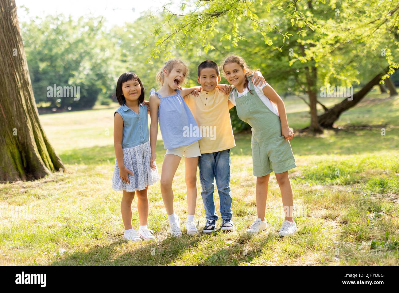 Group of cute asian and caucasian kids having fun in the park Stock ...