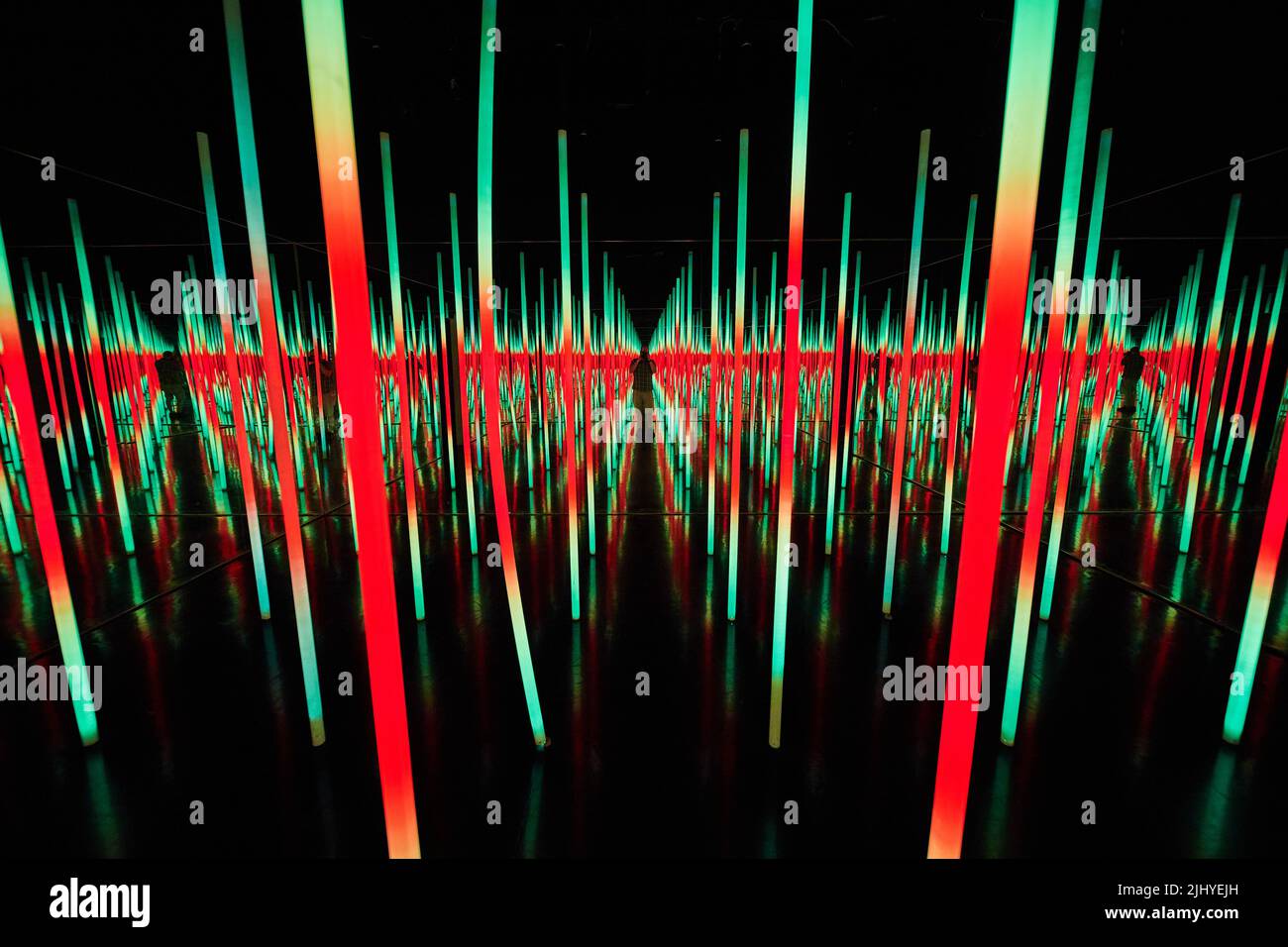 Green and red LED light poles in infinity mirror room Stock Photo Alamy