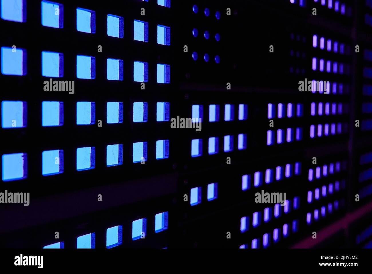 Computer wall board of blue and purple square lights Stock Photo