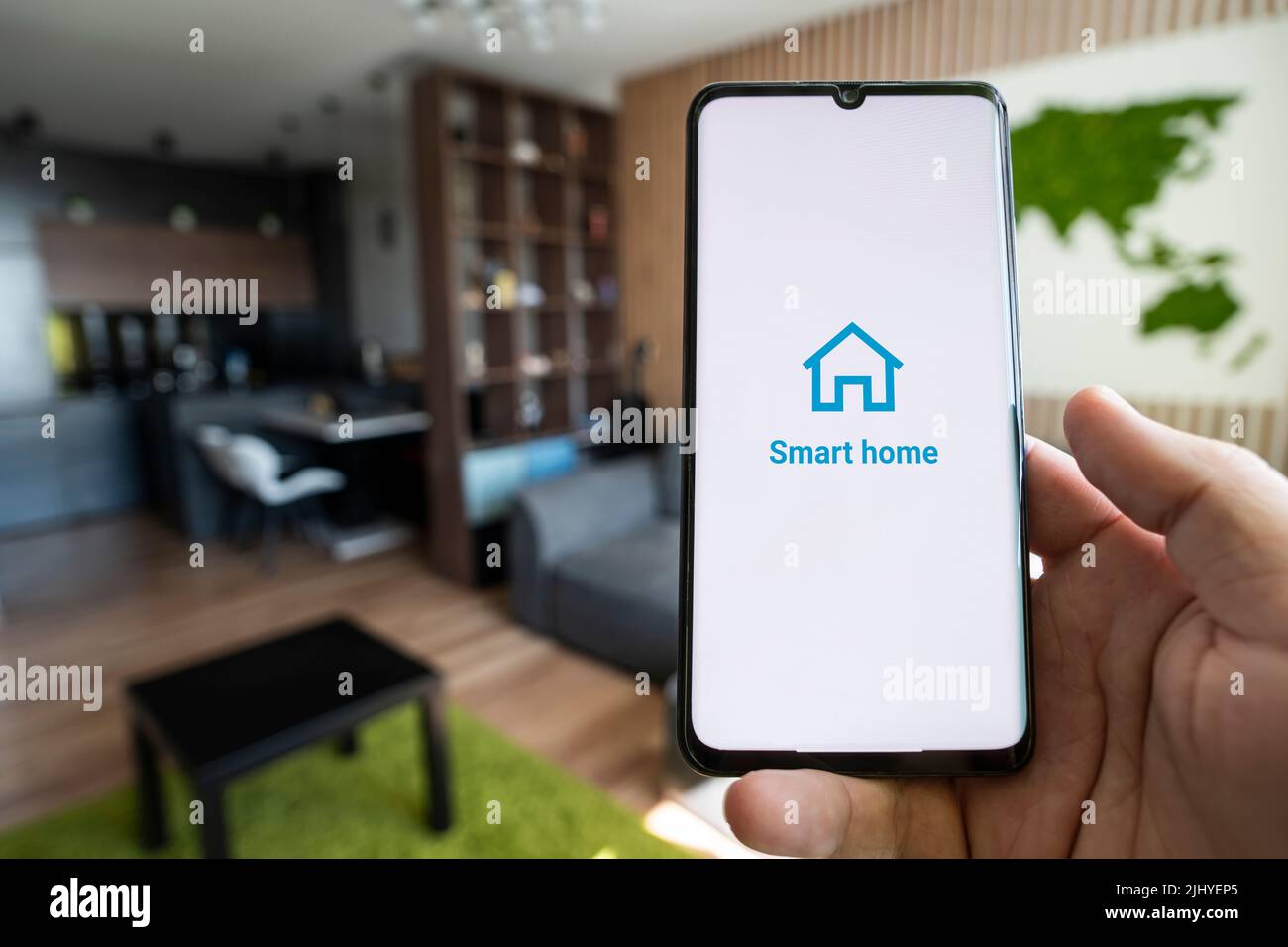 smart home app on smartphone. remote control of electronic devices in apartment. concept of controlling smart electronics in the house. Internet of Th Stock Photo