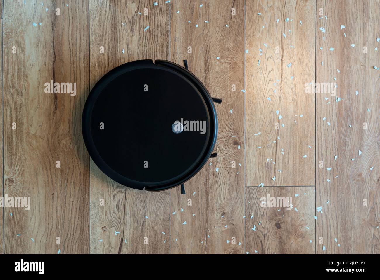 Robotic vacuum cleaner on laminate wood floor smart cleaning technology