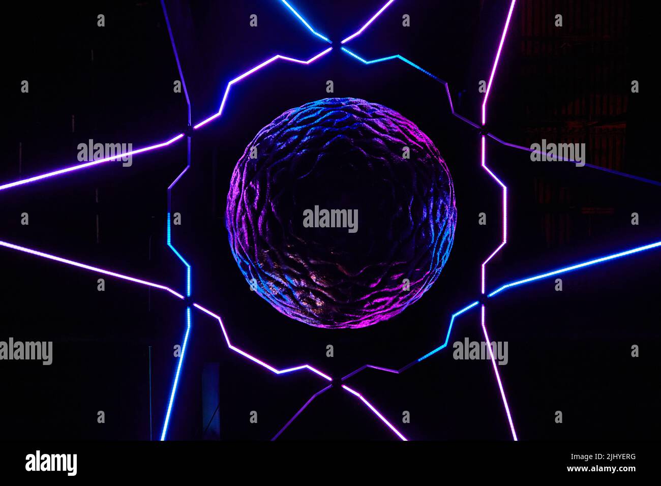 Abstract floating brain with neon lights and star pattern Stock Photo
