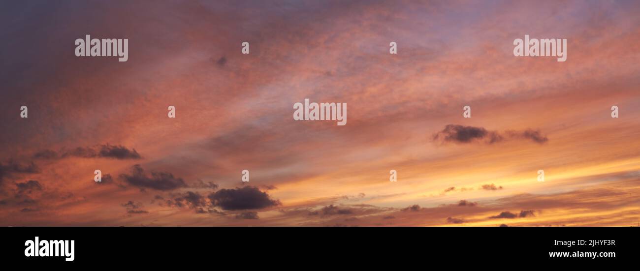 Copy space of clouds in a moody sky at twilight. Scenic panoramic and banner of a dramatic cloudscape and thunderous background at sunrise or sunset Stock Photo