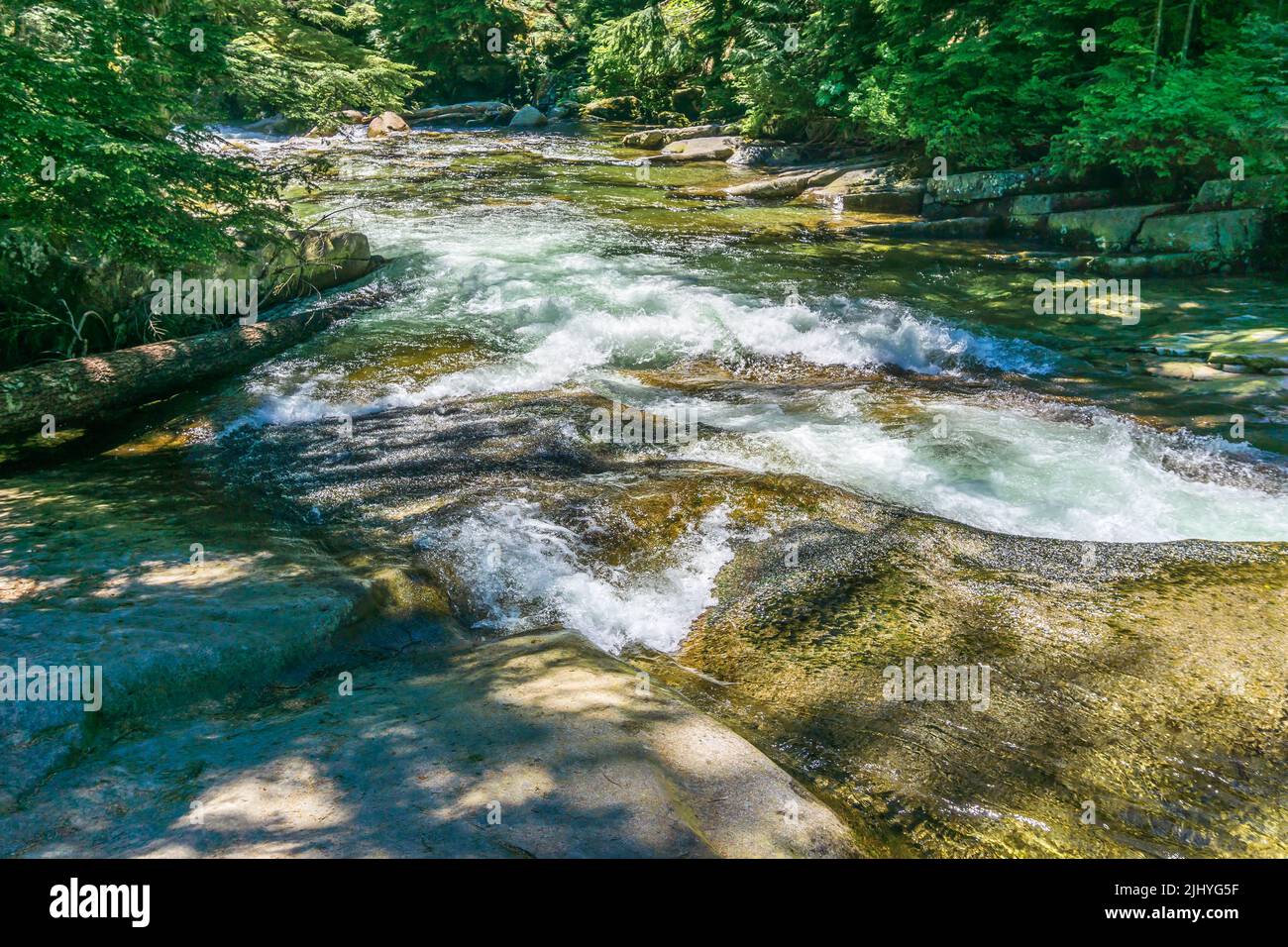 Rushing water rapids at Denny Creek in Washington State. Stock Photo