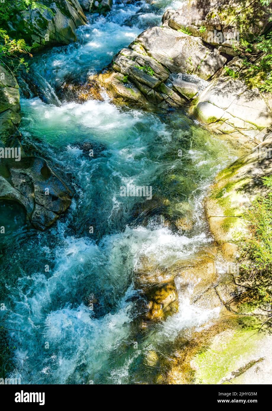 Rushing water rapids at Denny Creek in Washington State. Stock Photo