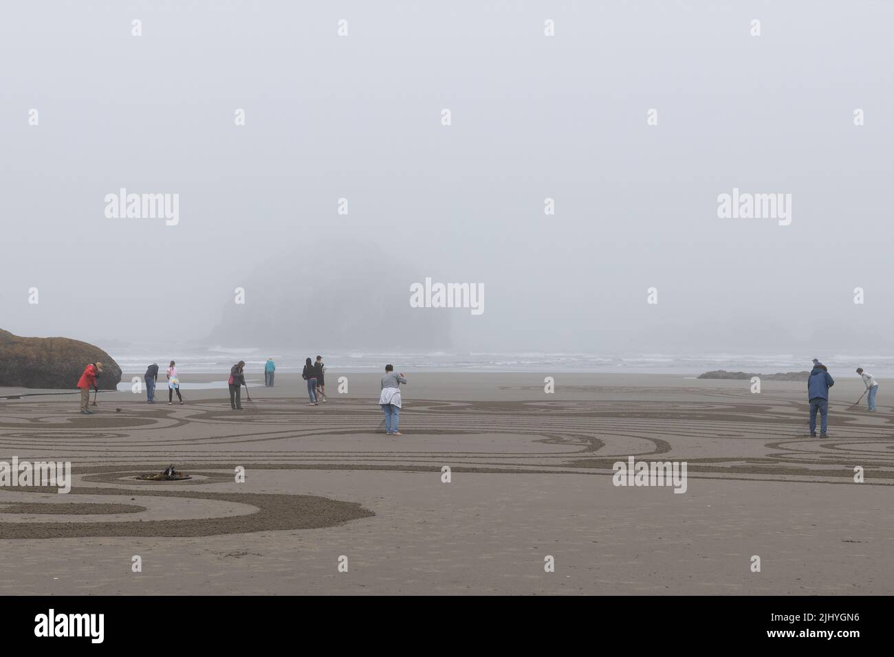 Artists of Circles in the Sand in Bandon, Oregon creating a labyrinth ...