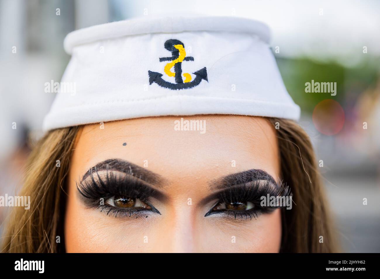 Berlin, Germany. 21st July, 2022. Amy Strong wears a sailor cap before the start of a Christopher Street Day (CSD) event on the Spree River. Credit: Christoph Soeder/dpa/Alamy Live News Stock Photo