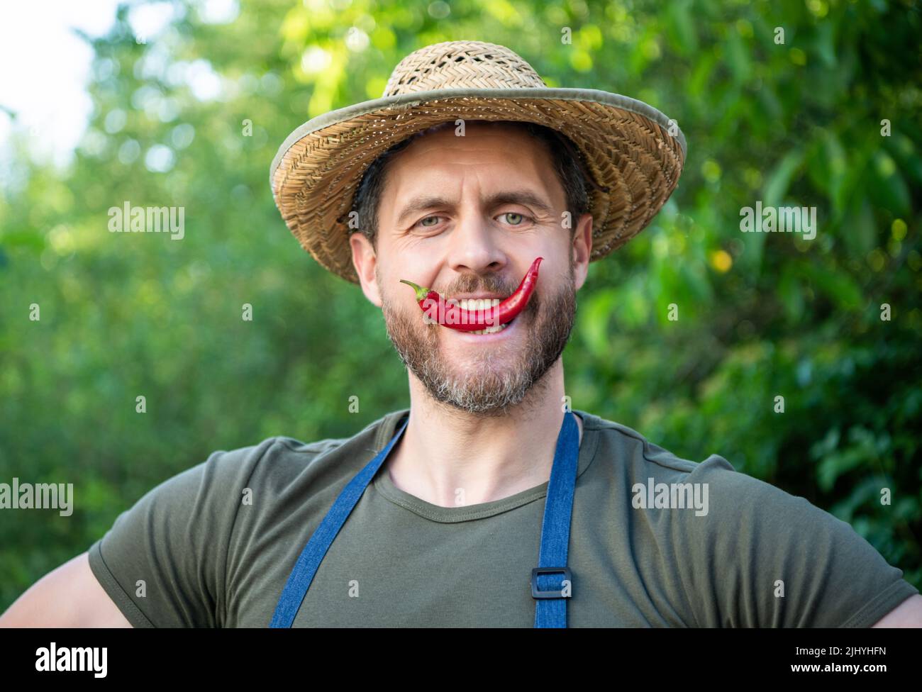 farmer villager in straw hat with chili pepper vegetable Stock Photo ...