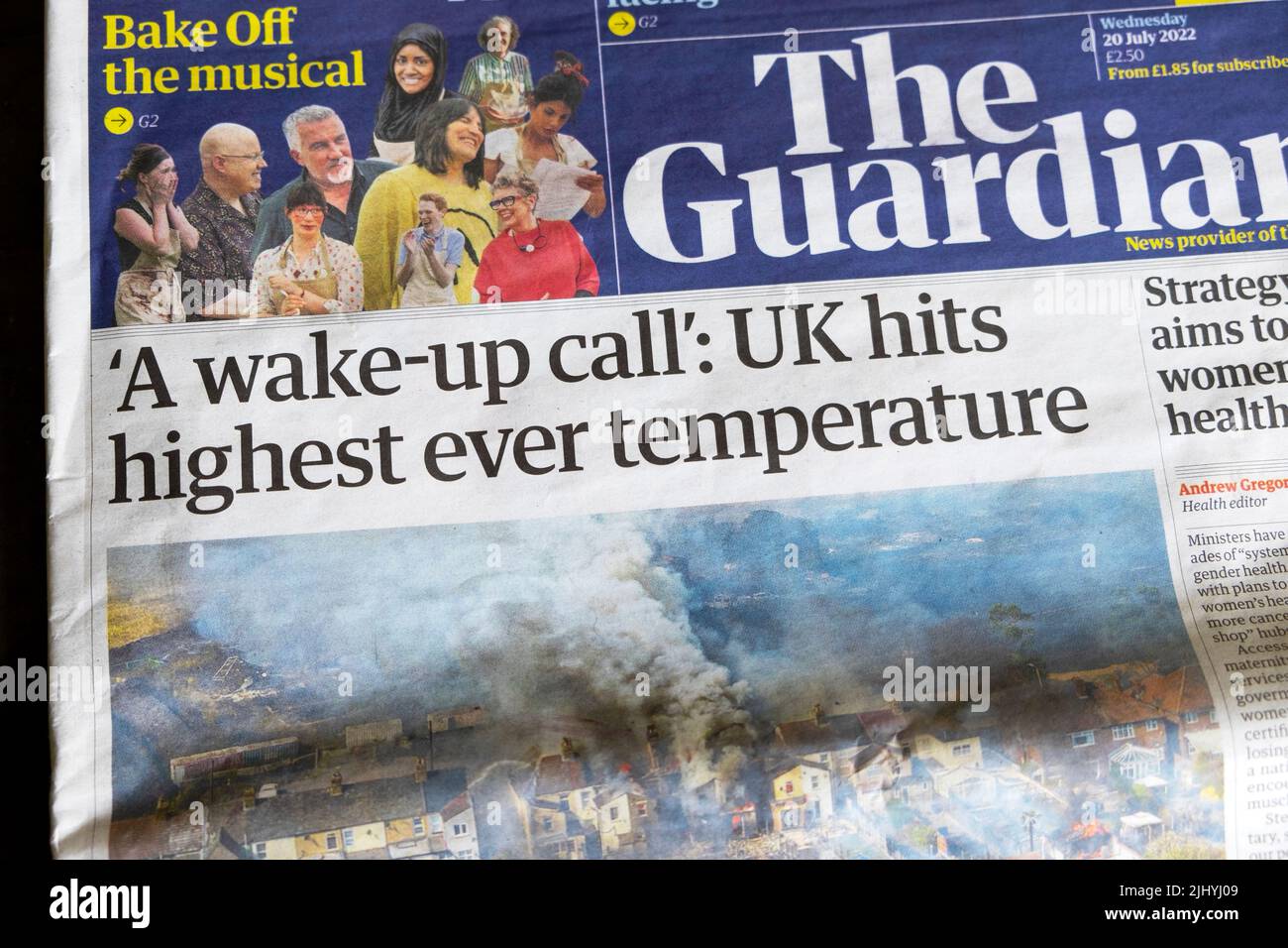 'A wake-up call: UK hits highest ever temperature' Guardian newspaper headline climate crisis front page newsstand 20th July 2022 in London England UK Stock Photo