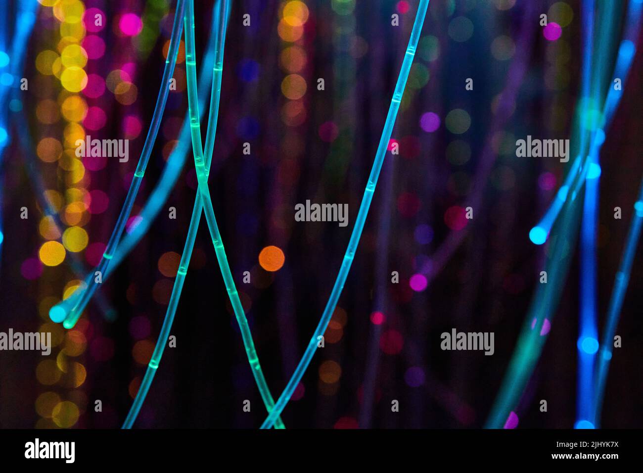 Strings of glowing neon lights in all colors Stock Photo Alamy