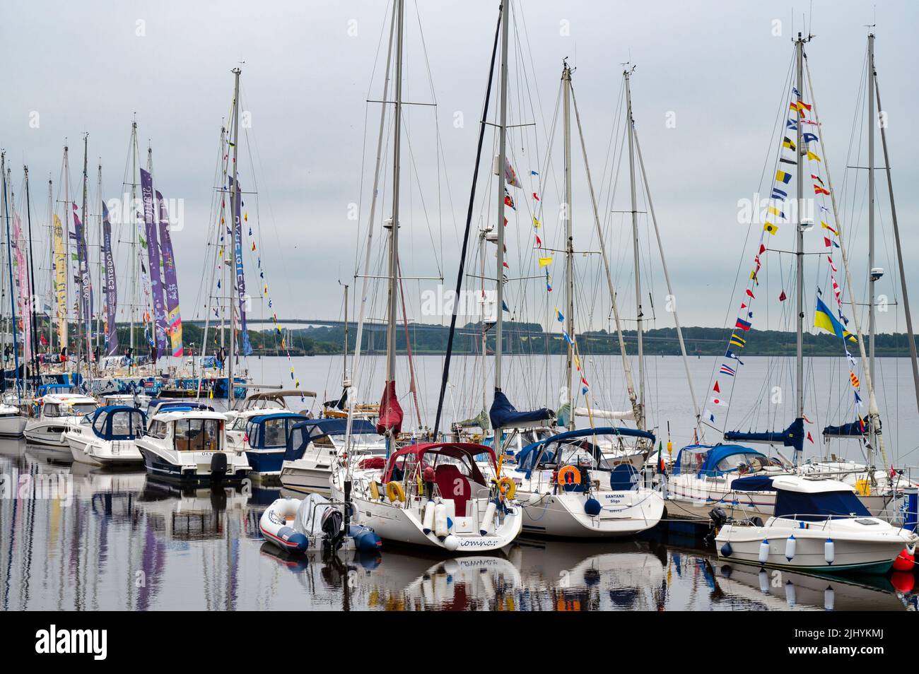 Derry, UK-  July 19, 2022: Sail boats lineds up for the Derry Clipper Festival to celebrate the Clipper Round the World Yachts Stock Photo