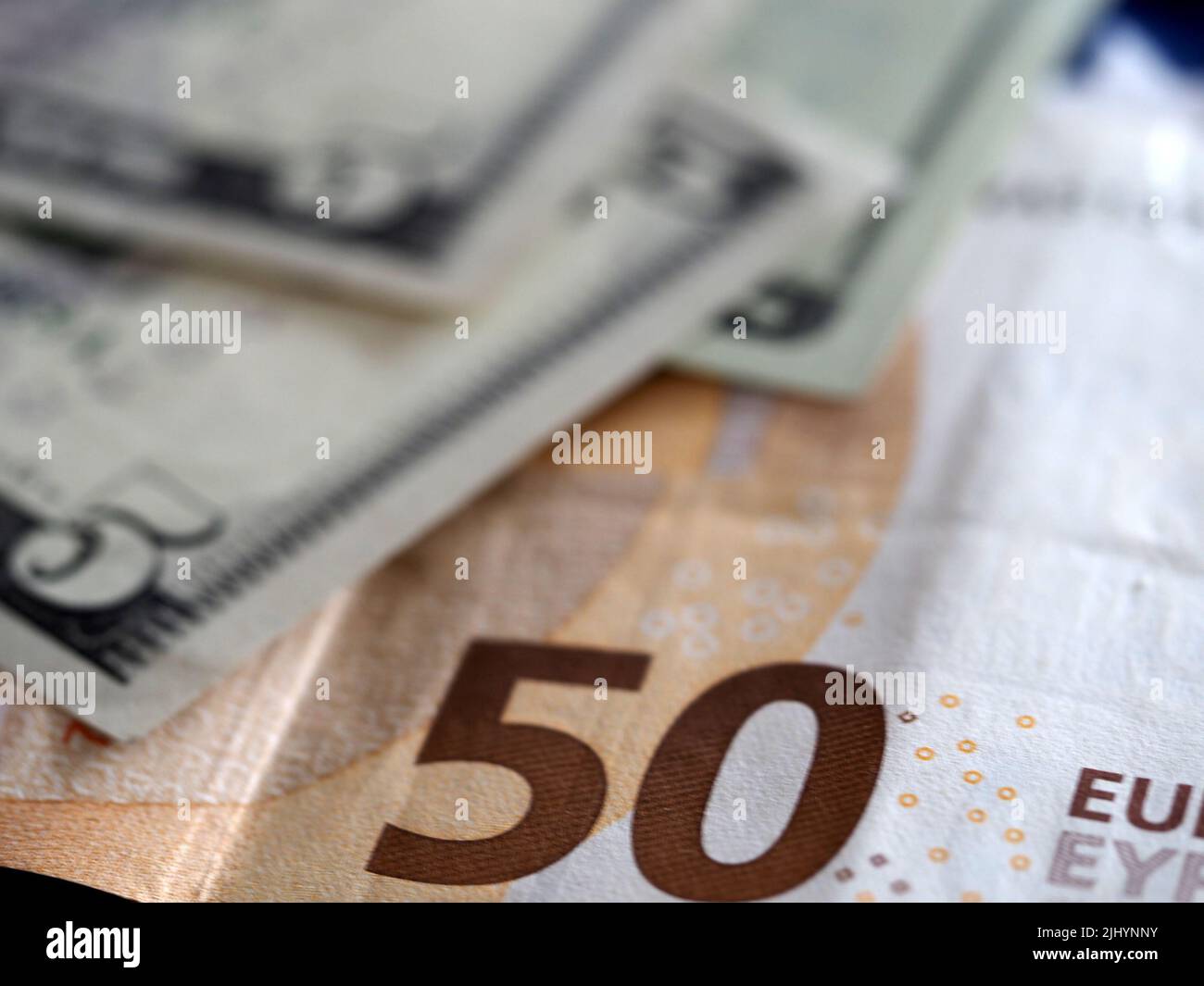 Germany. 21st July, 2022. In this photo illustration, five dollar bills and a fifty euro bill seen on display. (Credit Image: © Igor Golovniov/SOPA Images via ZUMA Press Wire) Stock Photo