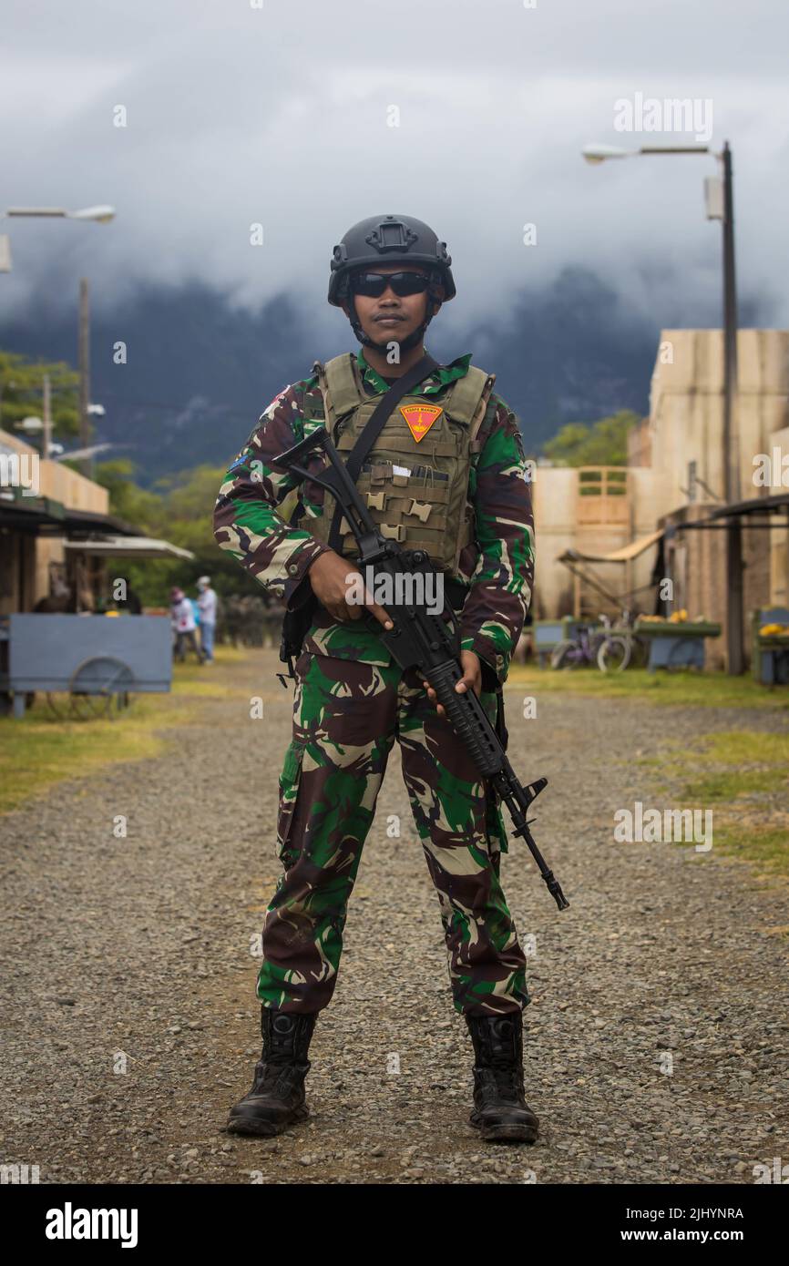 Indonesian Marine rifleman P1C Evan Verdiansyah stands guard during multinational Military Operations simulated urban terrain warfare exercise as part of the Rim of the Pacific, July 15, 2022 in Bellows Air Force Station, Hawaii. Stock Photo