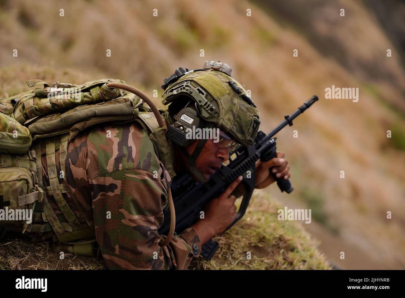 A Royal Tongan Marine waits for clearance to begin firing on a target during a simulated urban terrain warfare exercise as part of the Rim of the Pacific exercises, July 12, 2022 in Bellows Air Force Station, Hawaii. Stock Photo