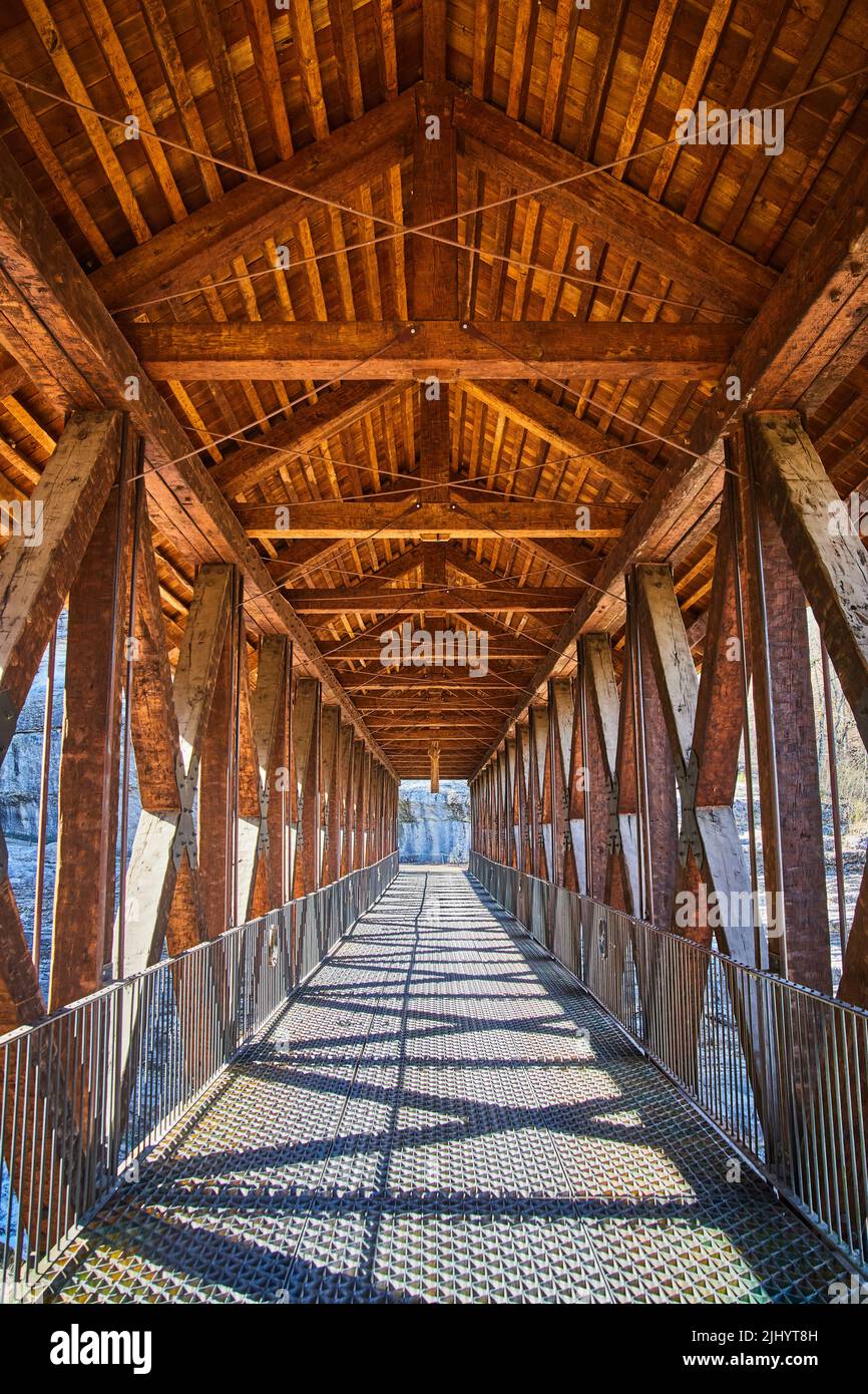 Walking through large wood walking bridge with metal floor Stock Photo ...