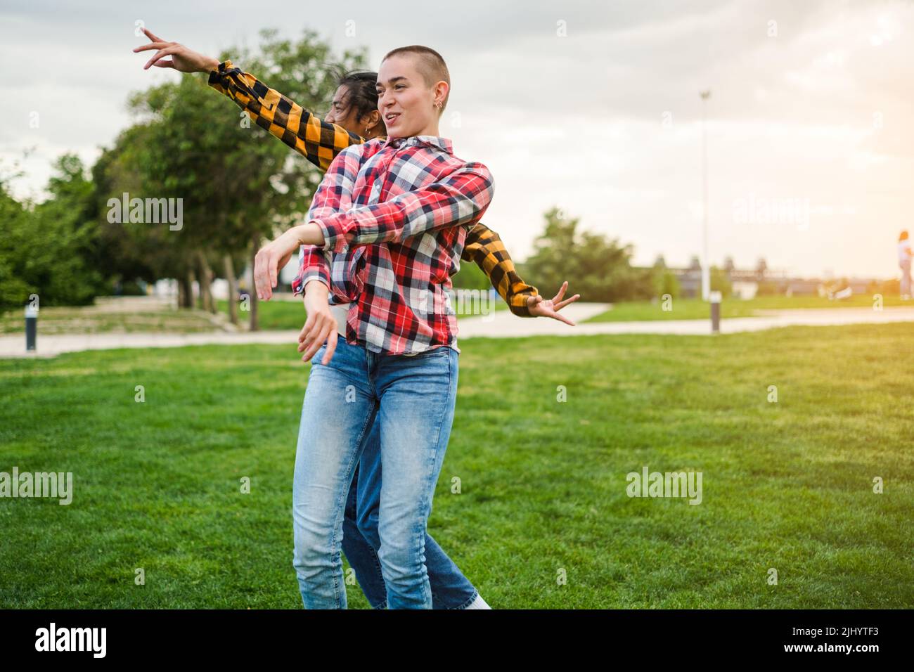 Woman dancing laughing in grass hi-res stock photography and images - Alamy