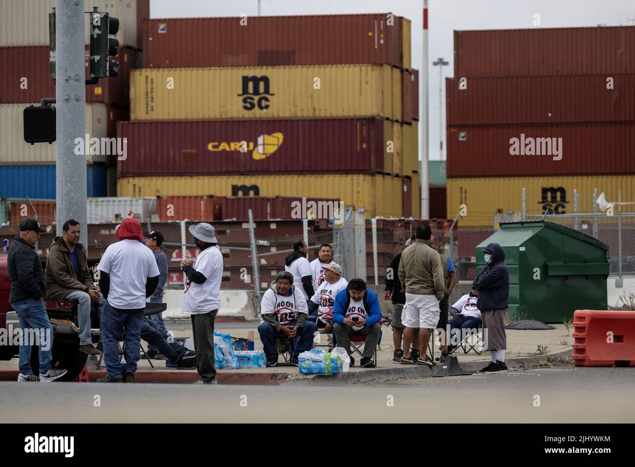 Truck drivers gather to block the entrance of trucks at a container terminal at the Port of Oakland, during a protest against California's law known as AB5, in Oakland, California, July 21, 2022. REUTERS/Carlos Barria Stock Photo