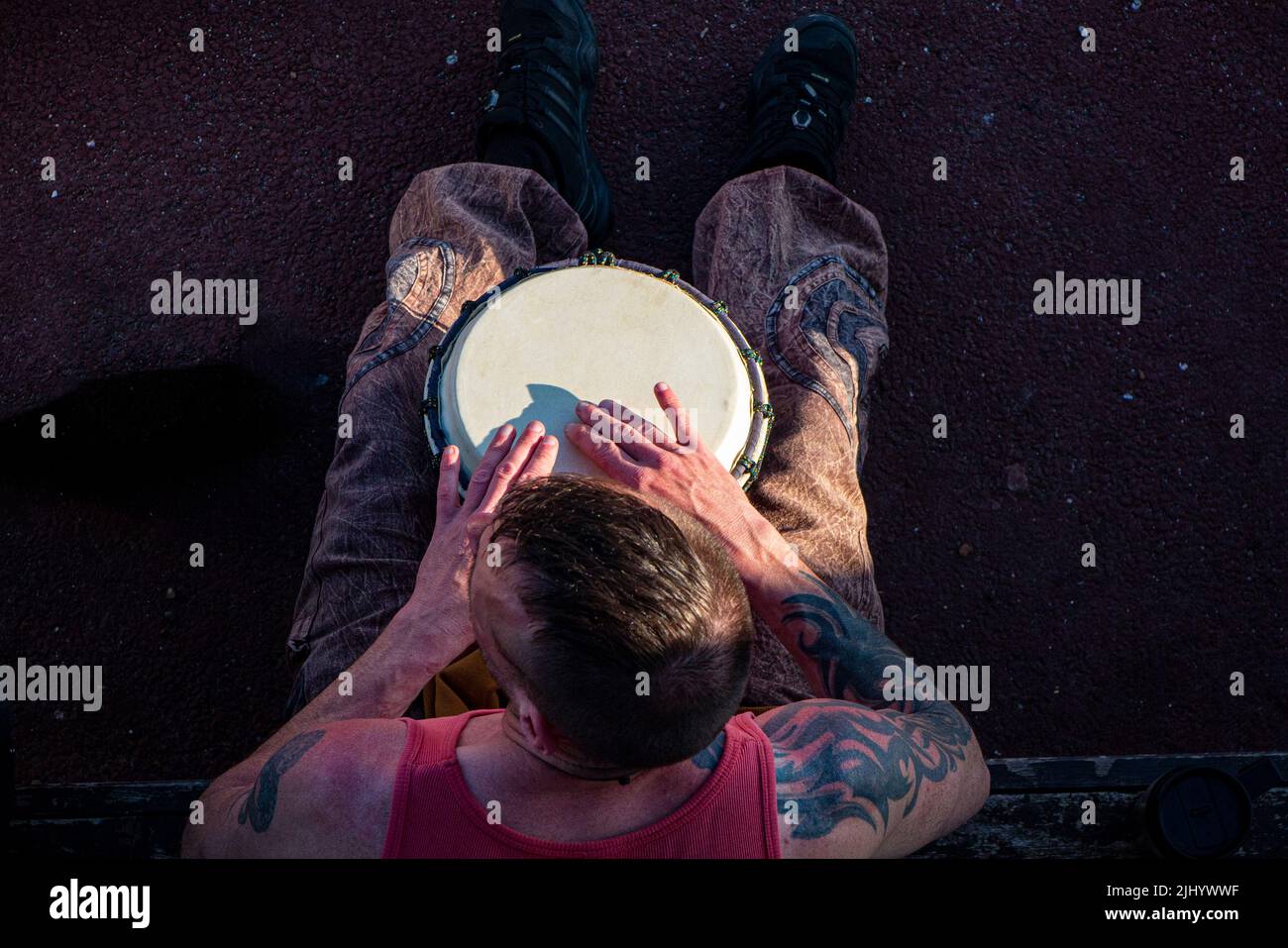 A cool St Leonard's resident plays his bongos on the beach at Goat