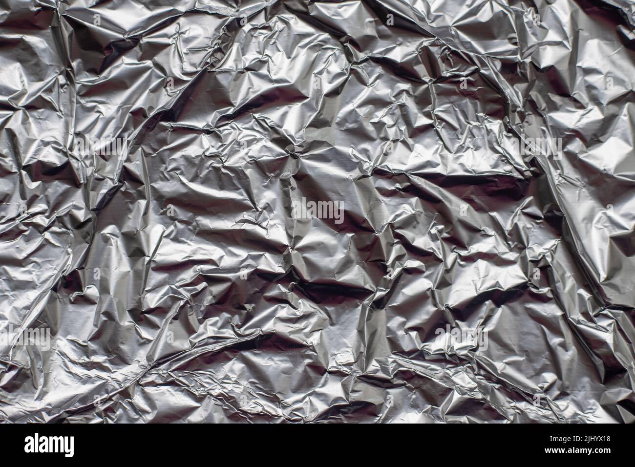 crumpled aluminium foil flat background and texture Stock Photo - Alamy