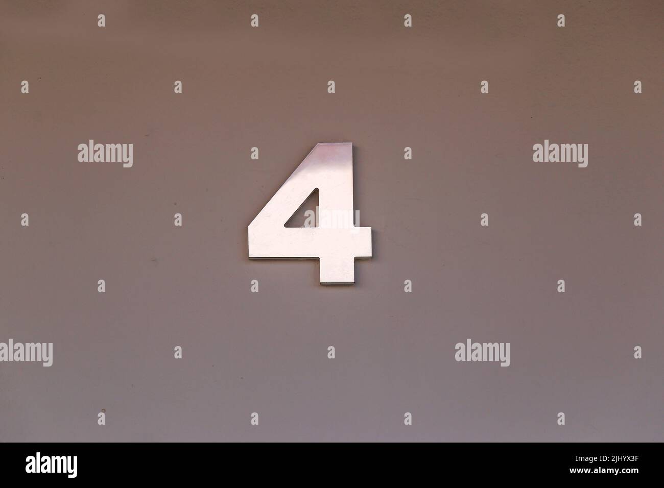 number four in metallic plate format, with copy space and gray tone - 4 Stock Photo