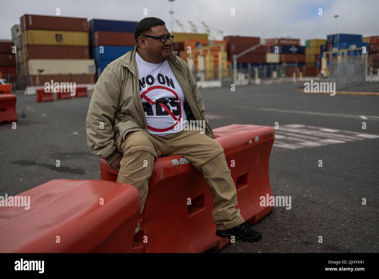 A truck driver block the entrance of trucks at a container terminal at the Port of Oakland, during a protest against California's law known as AB5, in Oakland, California, July 21, 2022. REUTERS/Carlos Barria Stock Photo