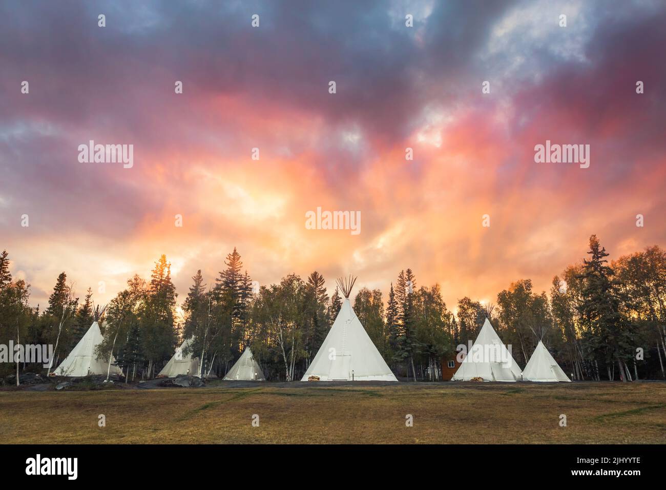 Teepees at sunset at Aurora Village in fall, outside of Yellowknife, Northwest Territories, Canada. Stock Photo