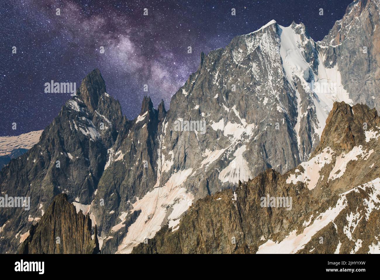Alpine landscape with night sky and milky way over Pointe Helbronner of the Massif of Mont Blanc, France Stock Photo