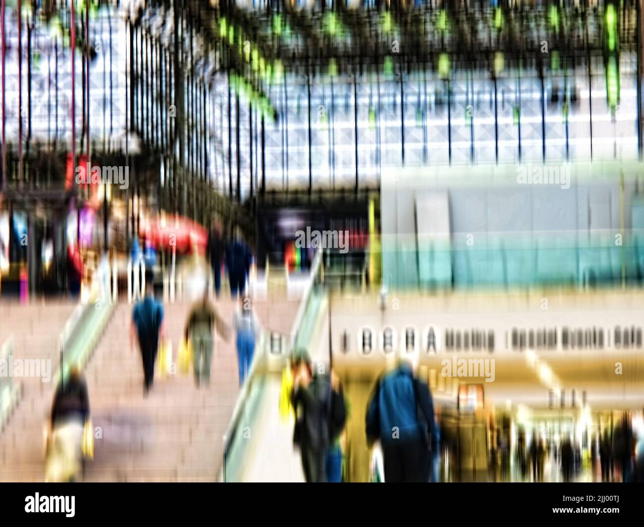Busy scene with lots of people in blurry motion in Manhattan, New York. Men and woman walking out of a mall after shopping and doing daily routine Stock Photo