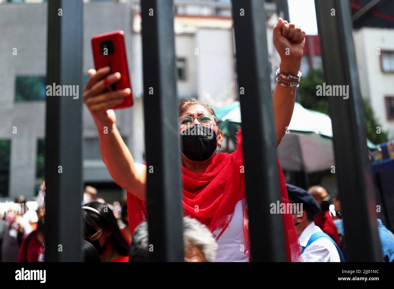 A woman attends a protest outside the headquarters of Telmex after the company's union went on strike after failing to come to an agreement with the company over a new collective labour agreement, in Mexico City, Mexico, July 21, 2022. REUTERS/Edgard Garrido Stock Photo