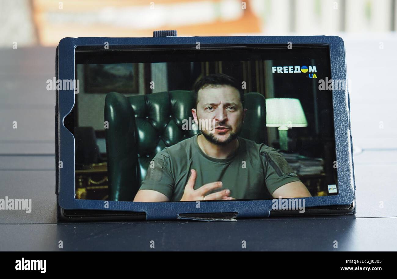 In this photo illustration a tablet screen showing the President of Ukraine Volodymyr Zelensky during his televised address where he spoke about First Lady Olena Zezenskaya's speech to the US Congress. Russian terror must lose, the president concluded. Stock Photo