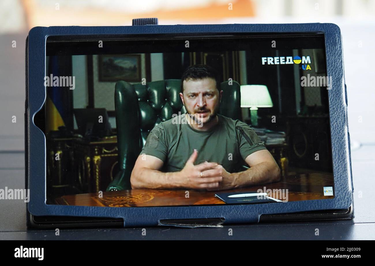 In this photo illustration a tablet screen showing the President of Ukraine Volodymyr Zelensky during his televised address where he spoke about First Lady Olena Zezenskaya's speech to the US Congress. Russian terror must lose, the president concluded. Stock Photo