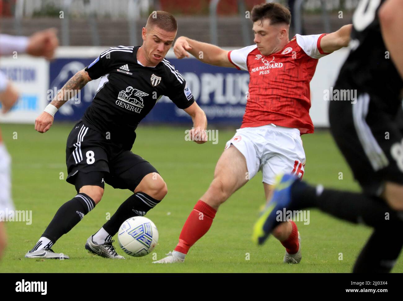 St Patrick's Athletic Adam O'Reilly and Mura's Luka Bobicanec battle for the ball during the UEFA Europa Conference League second qualifying round first leg match at Richmond Park, Dublin. Picture date: Thursday July 21, 2022. Stock Photo