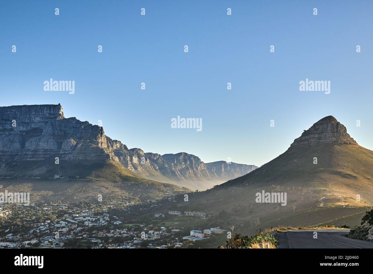 Mountain background, landscape of Table mountain and suburb with private houses against a blue sky background with copyspace. Beautiful view of Stock Photo