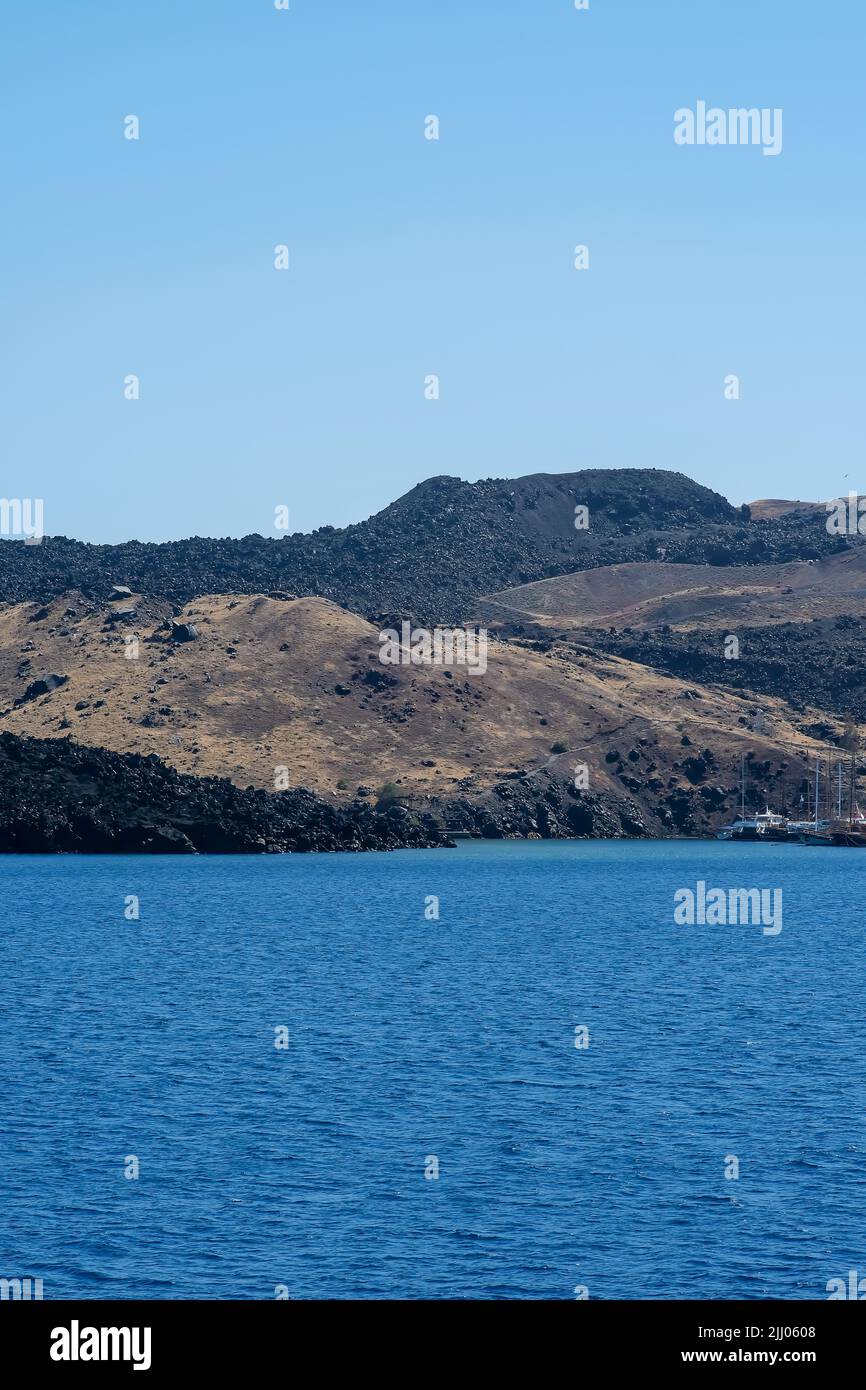 Close up view of the island of volcanic origin, Nea Kameni, that has