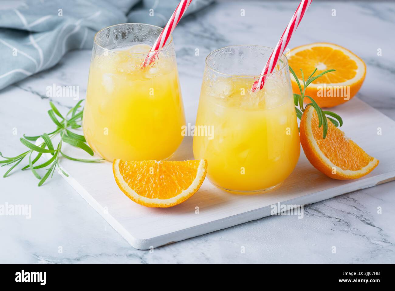 Glass of orange juice with ice. Cold orange fresh. Glass of orange