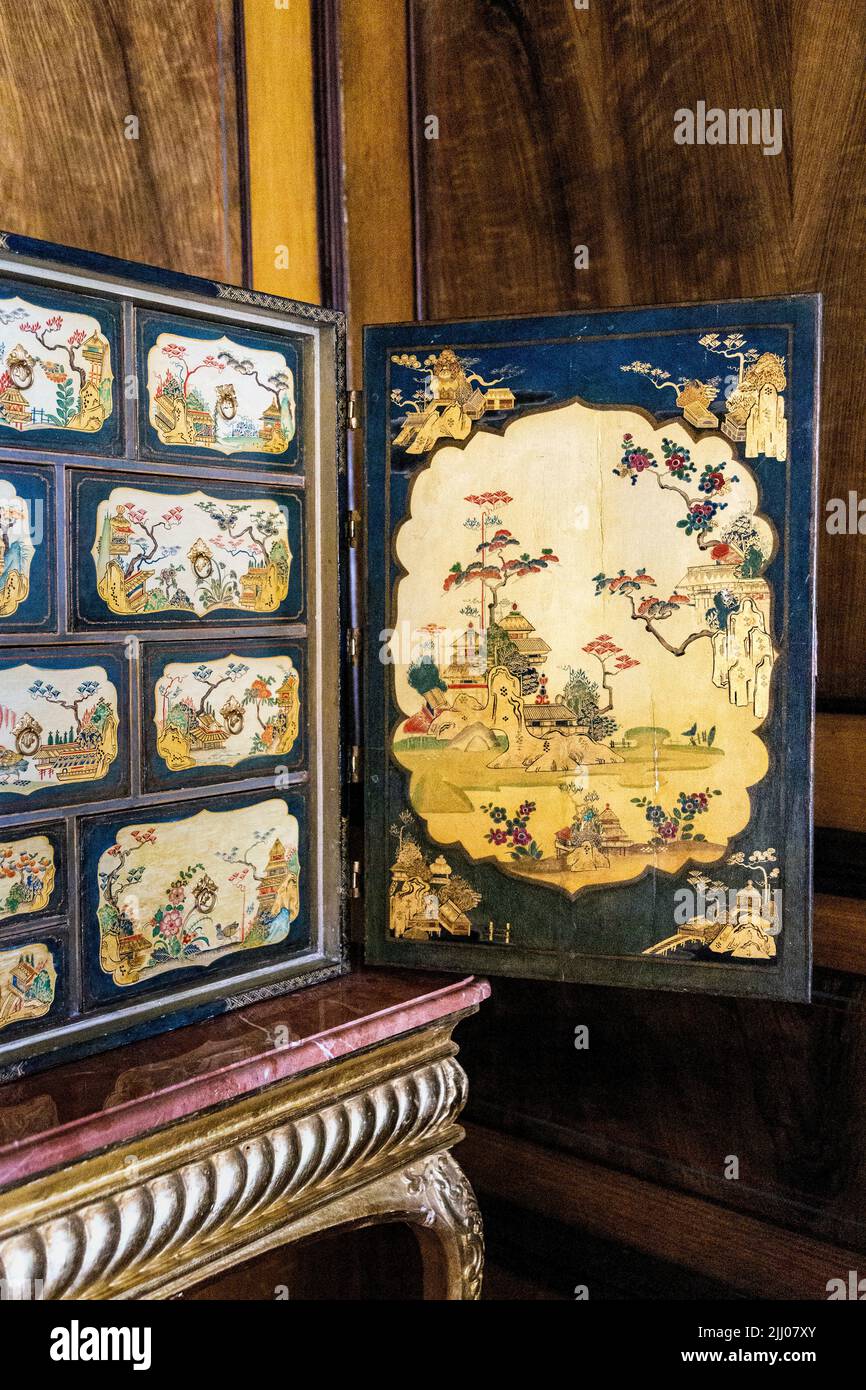 18th century oriental style lacquered cabinet with painted scenes in the Chinese Room at 17th century baroque royal Wilanow Palace, Warsaw, Poland Stock Photo