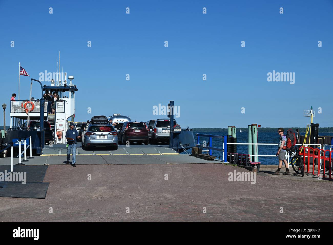 Cars load onto a ferry preparing to leave Bayfield, WI for Madeline