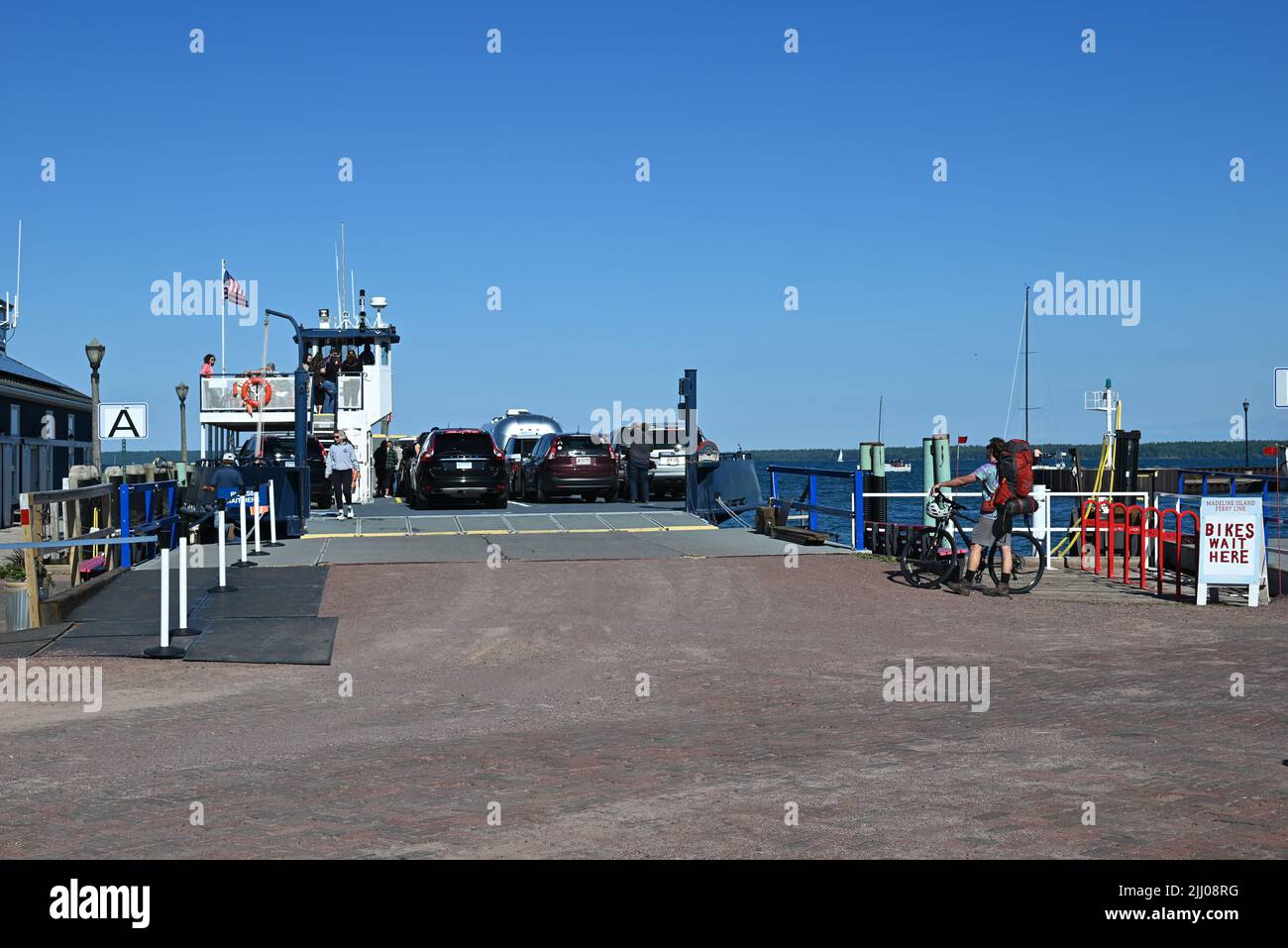 Cars load onto a ferry preparing to leave Bayfield, WI for Madeline