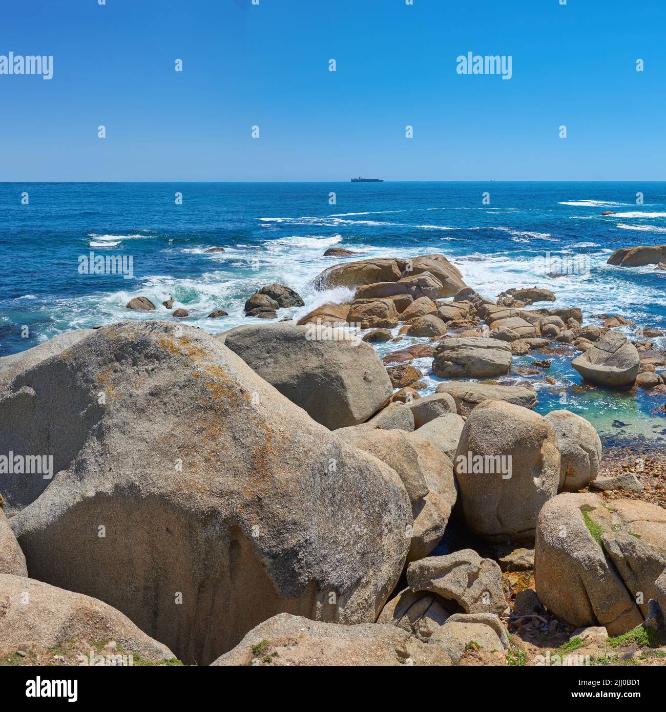 South African Rocks Beautiful seascape beach waves splashing against boulders or big stones ...