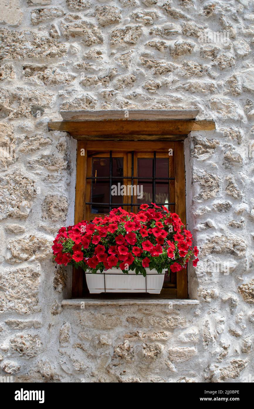 Red geranium window box in Mostar, Bosnia and Herzegovina's Bazaar section Stock Photo
