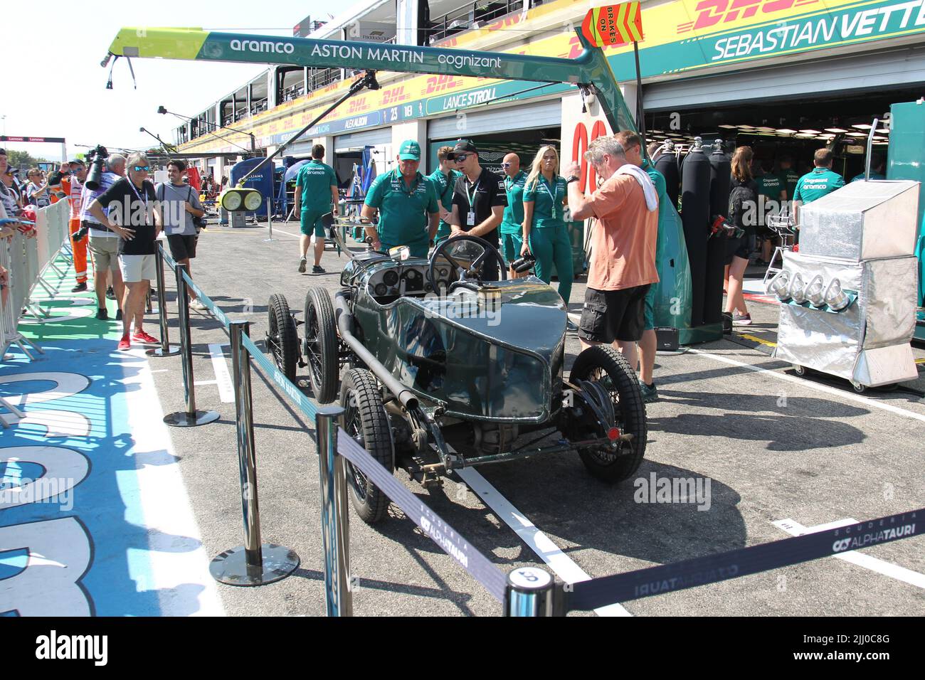 jul 21 2022 Le Castellet, France - F1 2022 France GP - Preparation Day - an old Aston Martin in front of Aston Martin Aramco Cognizant F1 Team garage Stock Photo